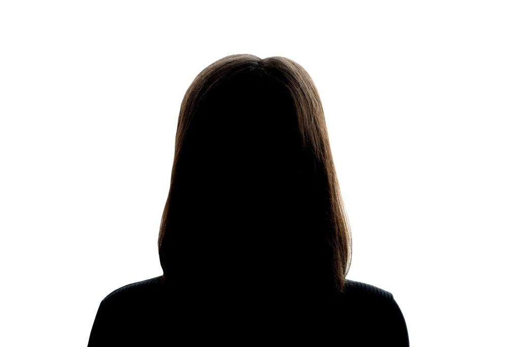 Dark silhouette of girl on a white background, the concept of anonymity